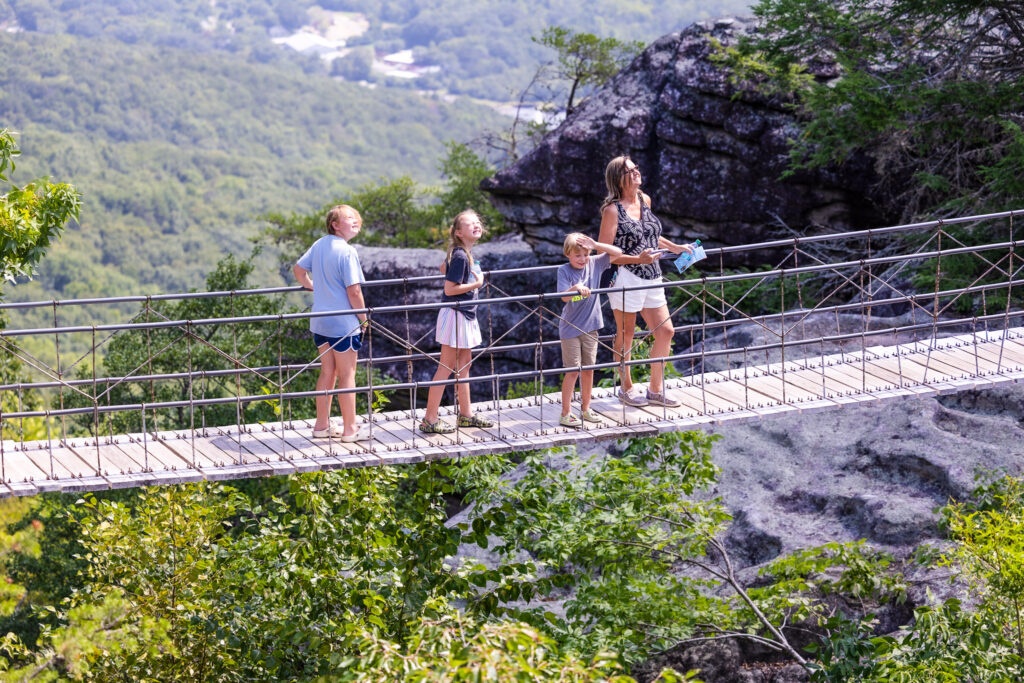 Crossing the Swing-A-Long Bridge, a top Chattanooga tourist attraction with incredible mountain views.