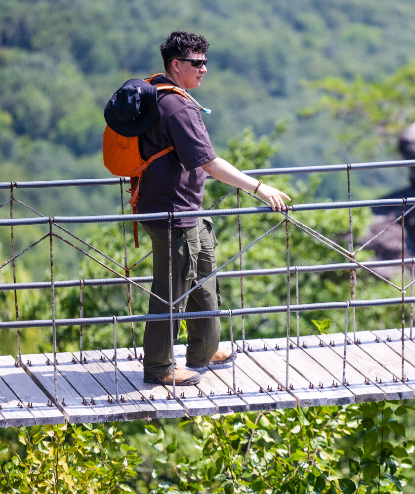 Crossing the Swing-A-Long Bridge, a top Chattanooga tourist attraction with incredible mountain views.