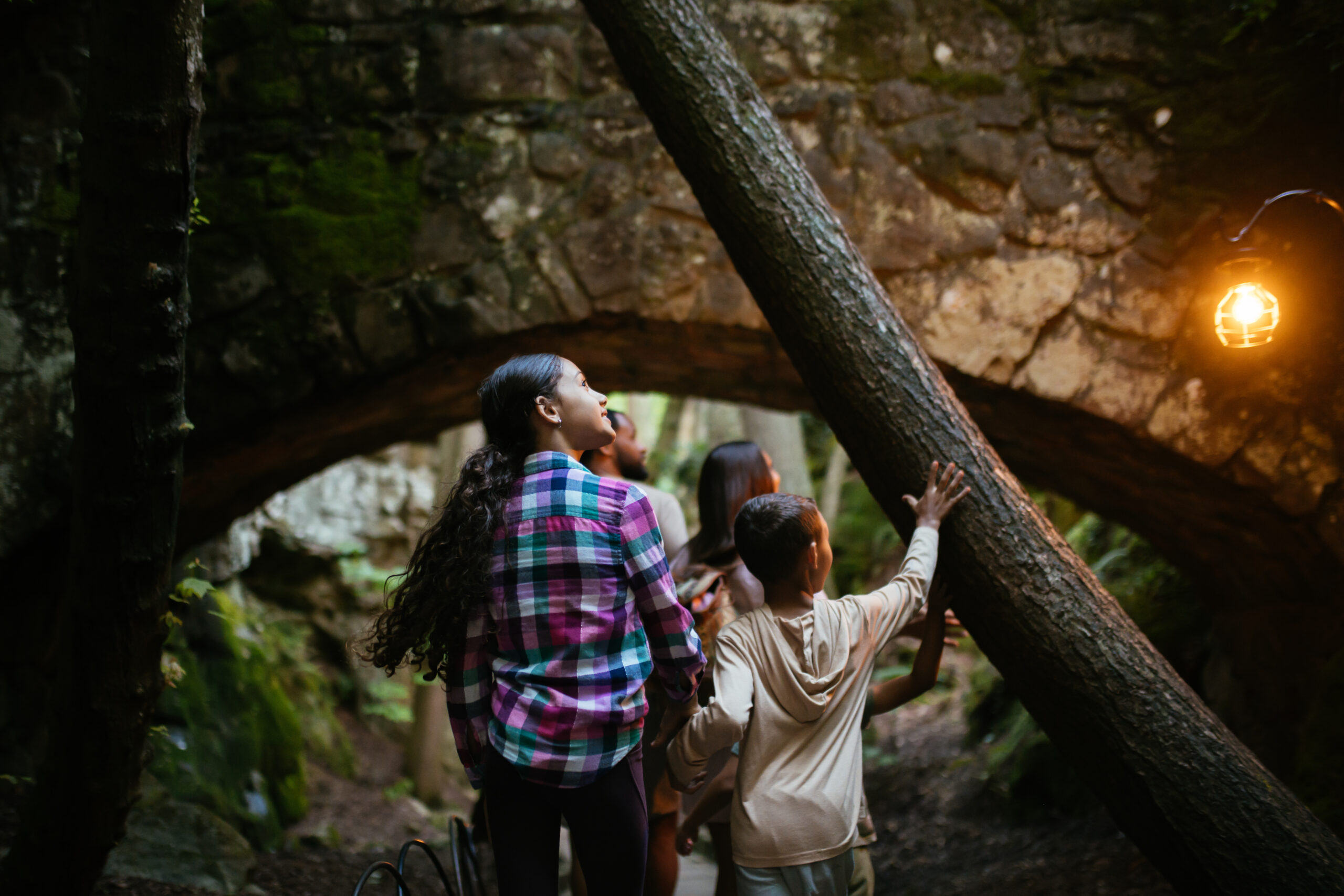 Kids enjoying a trail at night at Rock City.